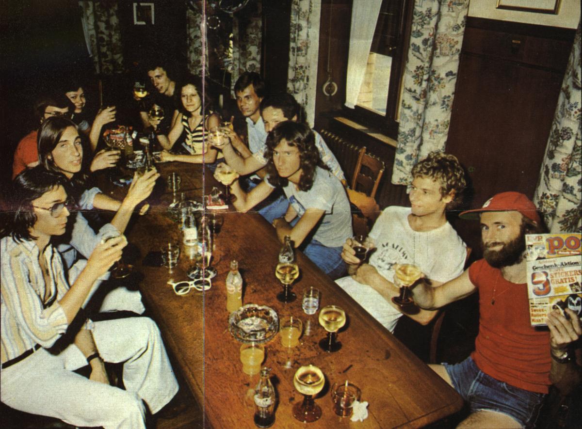 The group of fans meet the band in a local restaurant